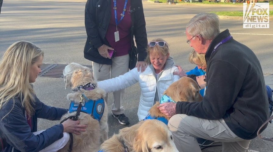 The Lutheran Church Charity's K-9 Crisis Response Team comforts mourners outside of The Covenant School