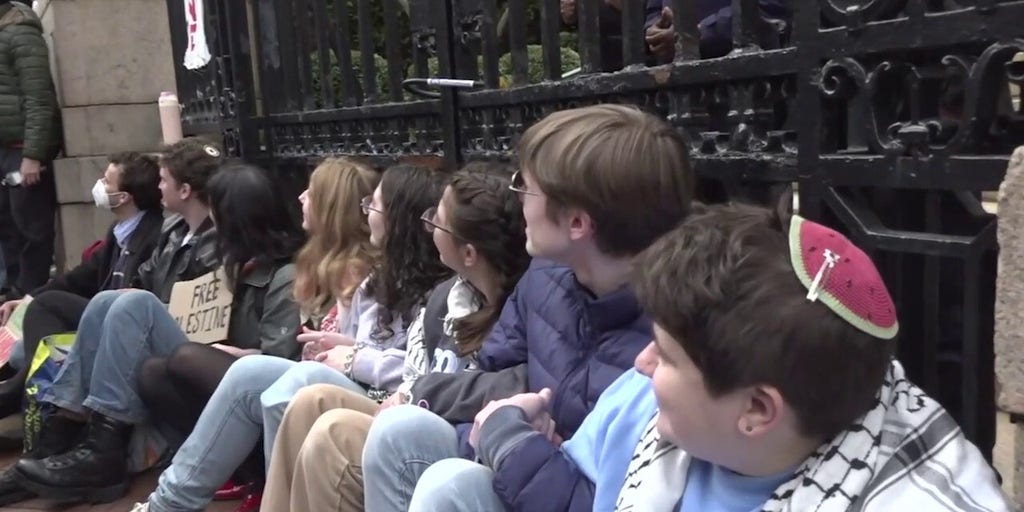 Columbia University students chain themselves to fence to protest Mahmoud Khalil's detention