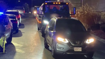 Car of suspect in Brown, MIT shootings towed away