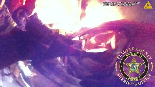 Florida sheriffs and firemen rescue civilian from fiery wreckage