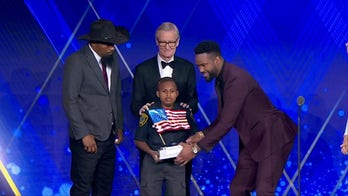 Devarjaye 'DJ' Daniel accepts 'Young Patriot Award' from Patriot Awards