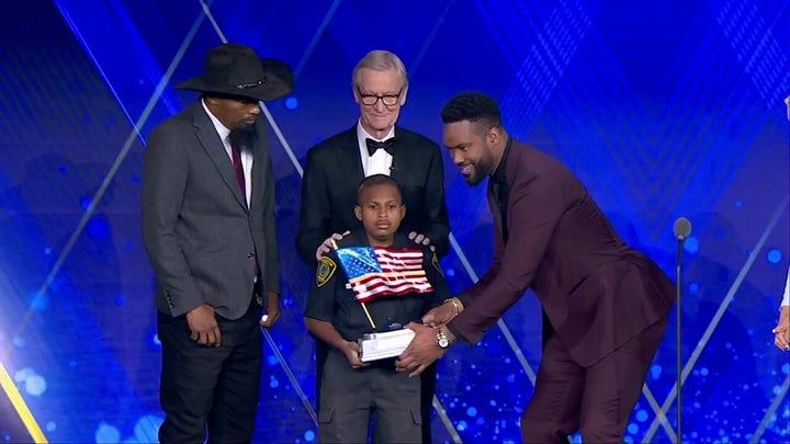 Devarjaye 'DJ' Daniel accepts 'Young Patriot Award' from Patriot Awards