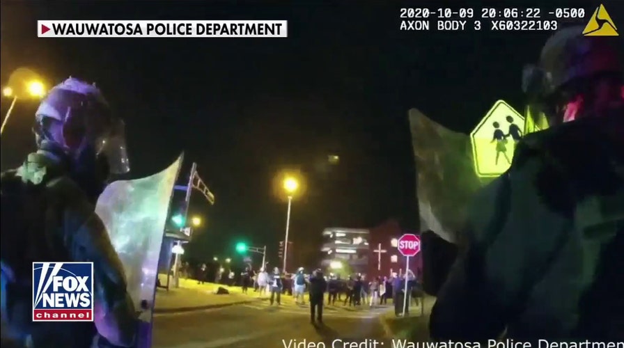 Protesters throw bottles at police officers in Wauwatosa