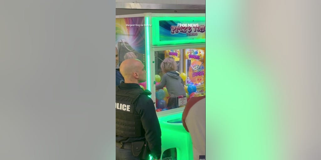 Toddler CLIMBS INTO CLAW MACHINE