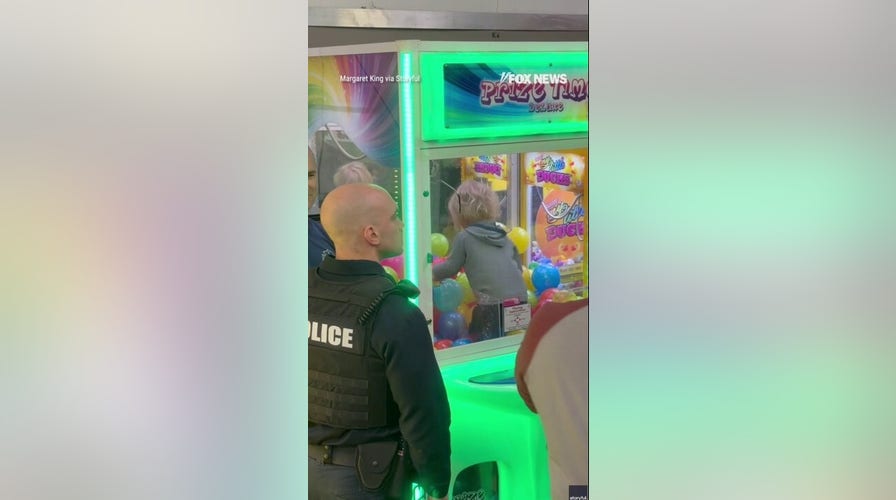 Toddler CLIMBS INTO CLAW MACHINE