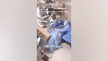Japanese surgeons SHIELD patient during powerful earthquake