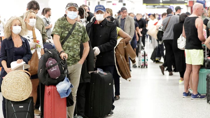 Chaos at US airports as Americans return home amid travel restrictions