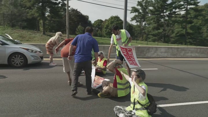 Climate activists arrested in DC after blocking road, angering commuters