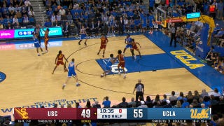 UCLA's Donovan Dent knocks down a three, beating the shot clock against the USC Trojans