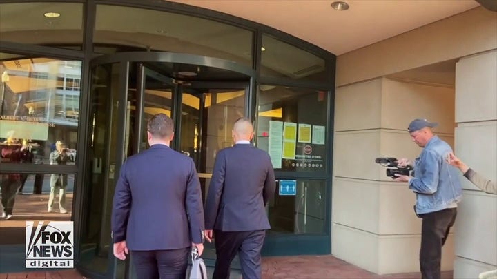Russian analyst who contributed to Steele dossier heads in and out of court