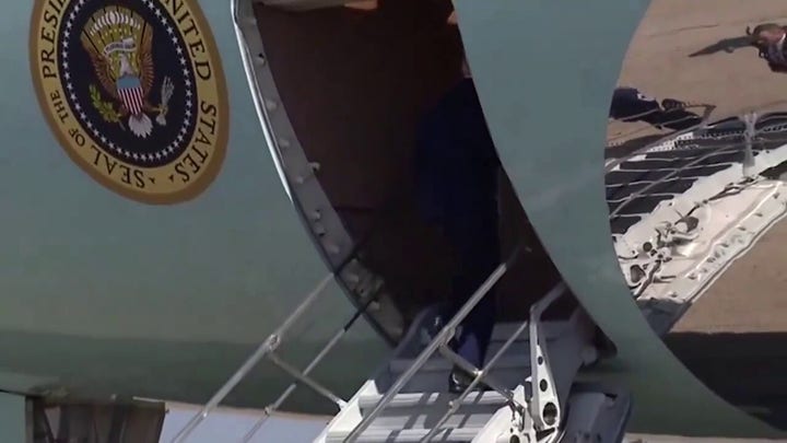 President Biden almost falls while walking up Air Force One stairs
