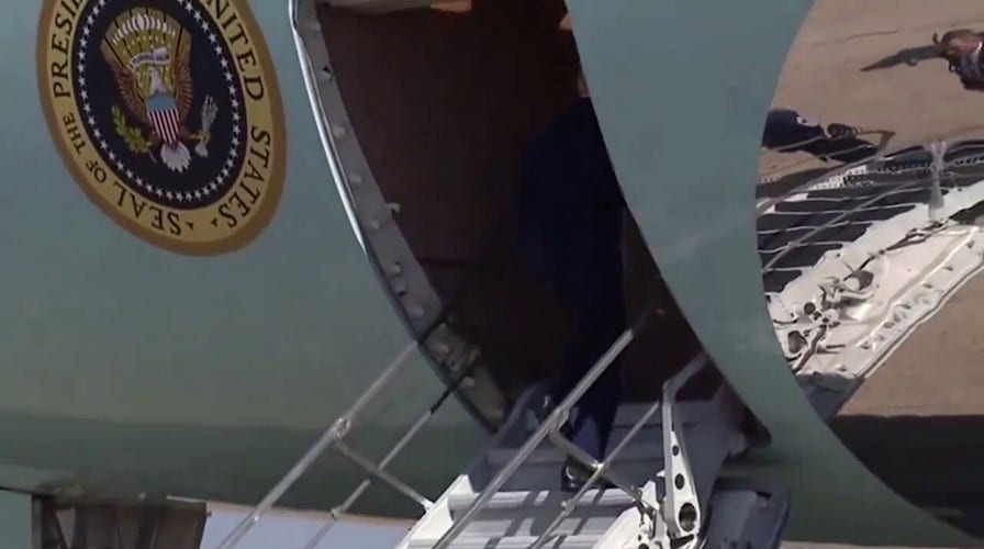 Biden almost falls while boarding plane
