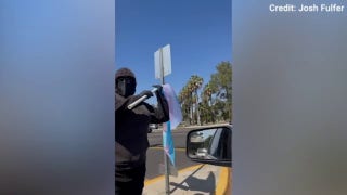 Protester arrested after alleged attack outside state track and field championship