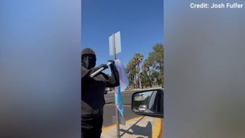 Protester arrested after alleged attack outside state track and field championship