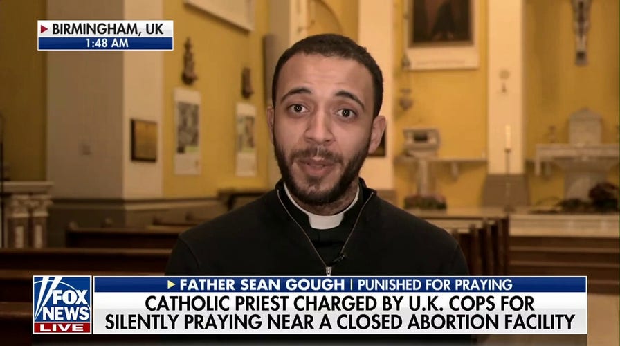 Priest charged after praying outside abortion clinic says free speech 'threatened'
