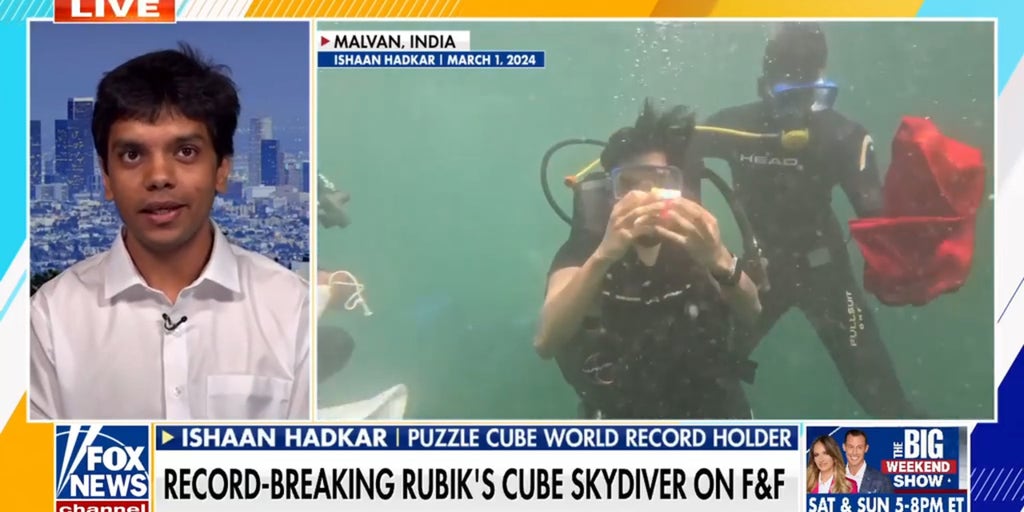 Rubik's Cube champion breaks world record while skydiving