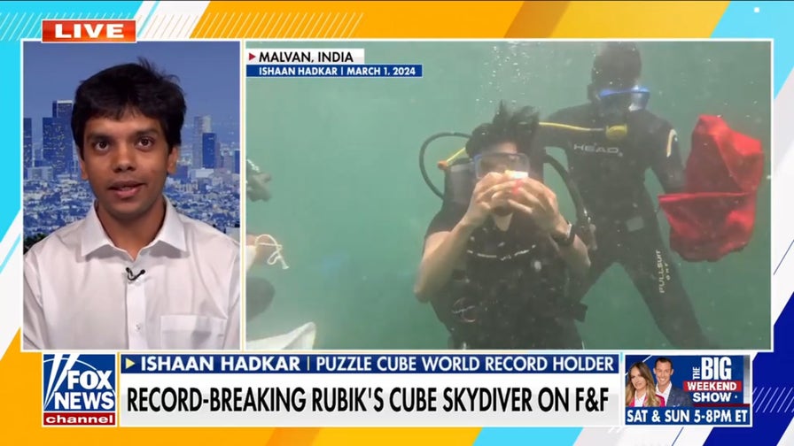 Rubik's Cube champion breaks world record while skydiving