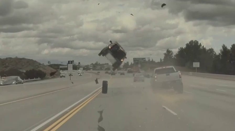 Car flips on Los Angeles freeway after tire pops off pickup truck, video shows