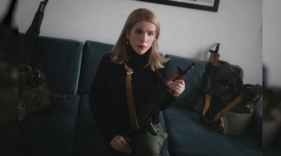 Ukrainian woman goes viral after posing AK-47 Kalashnikov rifle 