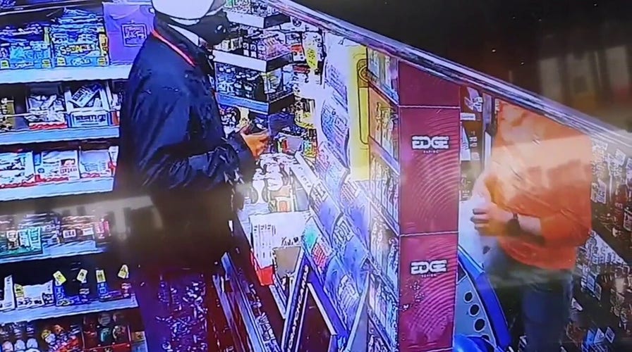 English shop owner traps would-be thief under store's front shutter