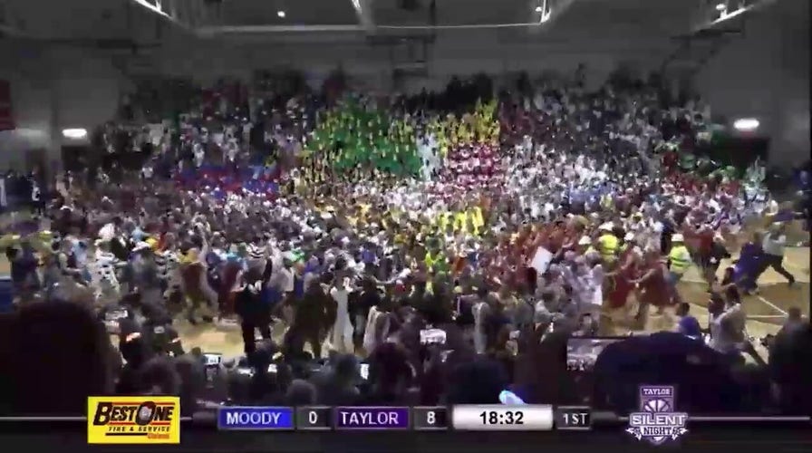 Taylor University basketball fans storm the court for ‘Silent Night’ game tradition