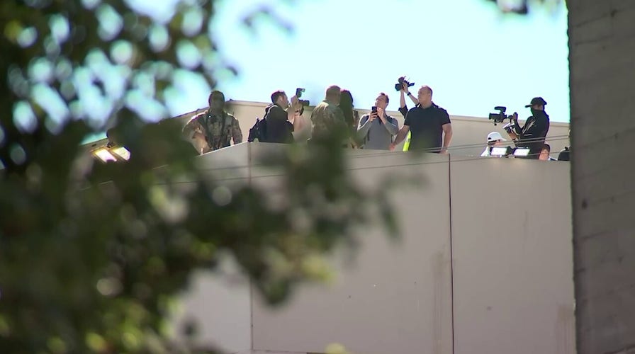 Noem visits Portland ICE facility, prays over staff