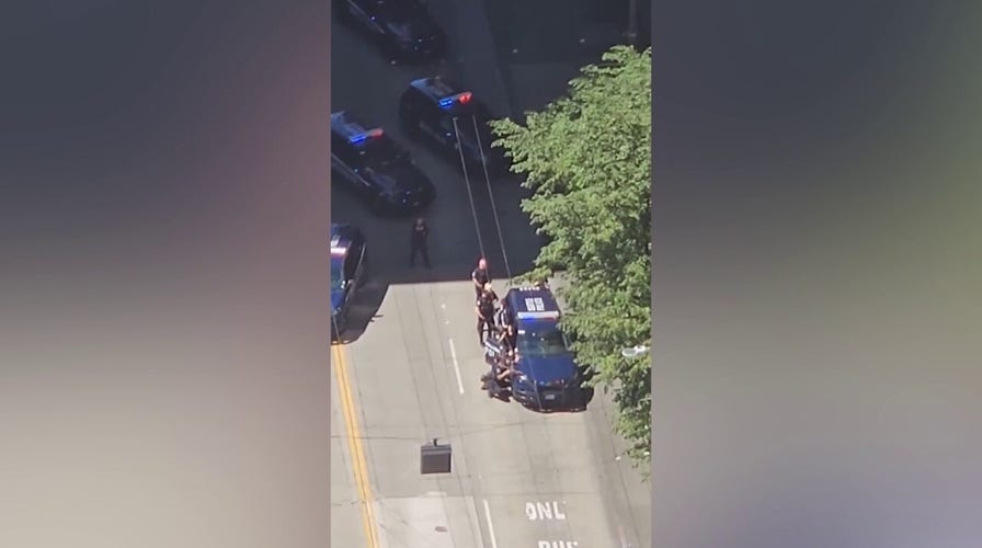 Police swarm Seattle FBI headquarters amid armed standoff