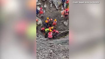Rescue crews in Nepal save two men trapped in tunnels for nine days following floods
