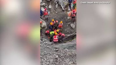 Rescue crews in Nepal save two men trapped in tunnels for nine days following floods