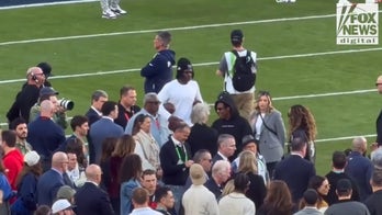 Jon Bon Jovi and Jay-Z greet each other at Super Bowl