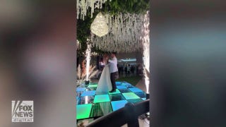 Wedding drama! Watch as a newly married couple keeps dancing when a fire breaks out behind them - Fox News