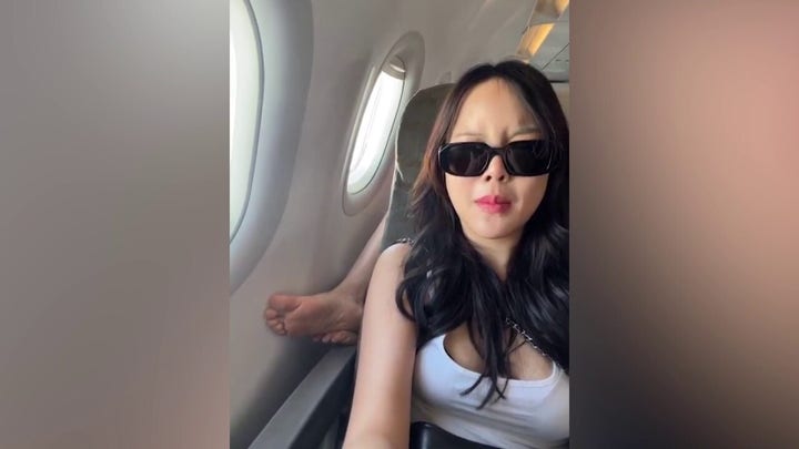 Airline passenger puts smelly, bare feet on another traveler's armrest — causing her to feel ‘ill’