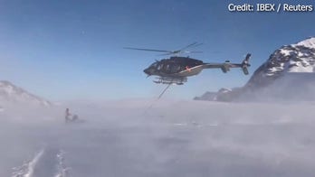 WATCH: Helicopter rescues plane from snowy mountain after emergency landing