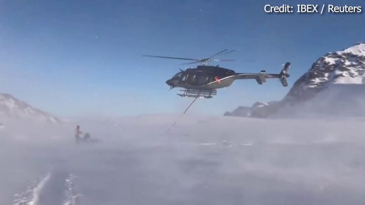 WATCH: Helicopter rescues plane from snowy mountain after emergency landing