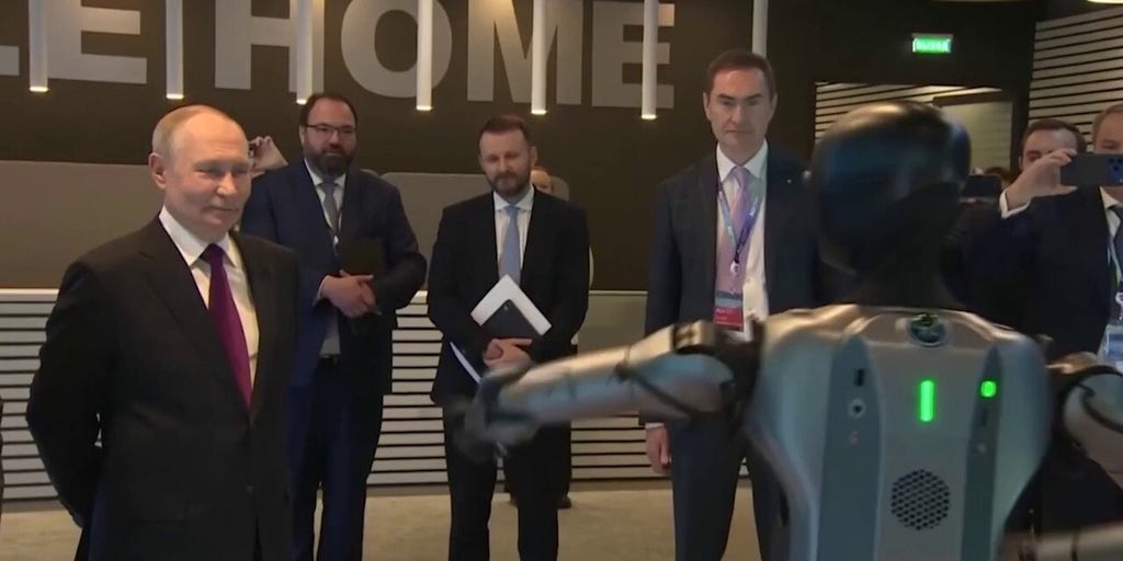 Putin watches awkward robot dance at Moscow AI conference