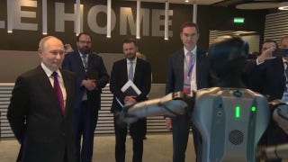 Putin watches awkward robot dance at Moscow AI conference