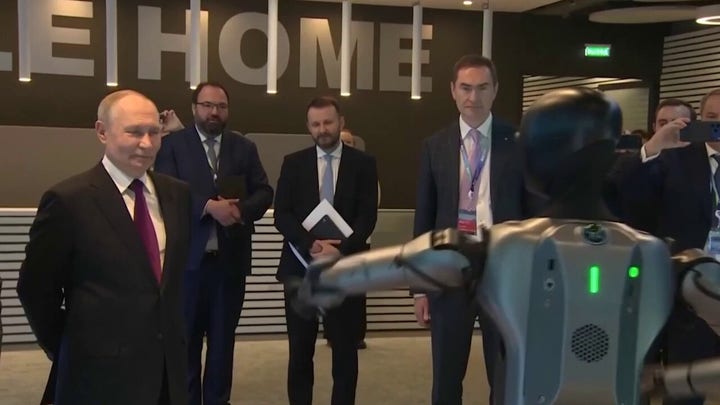 Putin watches awkward robot dance at Moscow AI conference