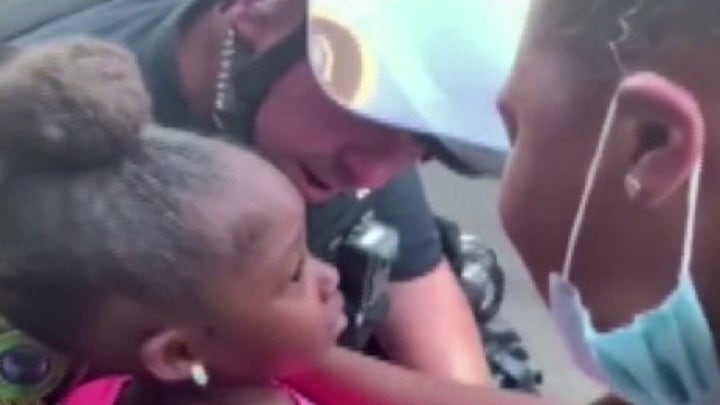 Texas police officer comforts crying girl during anti-racism protest: I'm here to protect you