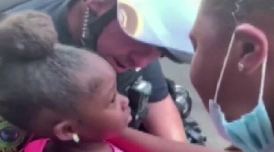 Texas police officer comforts crying girl during anti-racism protest: I'm here to protect you