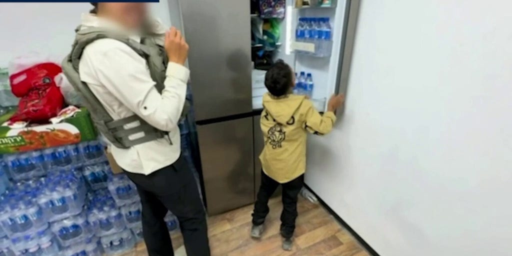 Gazan boy found alive plays with GHF representative