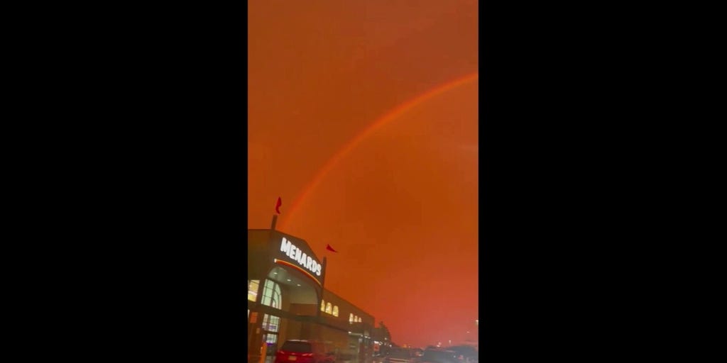 Red sky filled with rainbow draws eyes upward in Minnesota