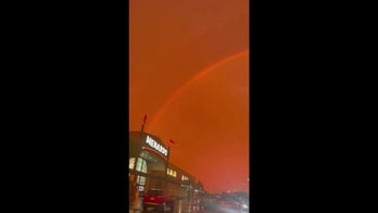 Red sky filled with rainbow draws eyes upward in Minnesota