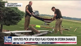 Indiana officers fold American flag found in tornado debris: 'It just felt right'