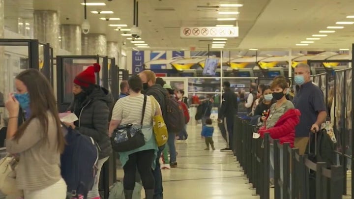 Holiday travelers juggle risks, rewards amid COVID-19 infection spike