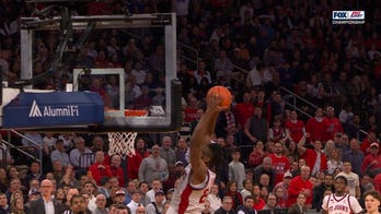 Bryce Hopkins lobs it up to Zuby Ejiofor for the slam on the fast break, extending St. John's lead over UConn
