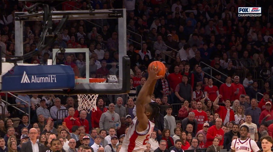 Bryce Hopkins lobs it up to Zuby Ejiofor for the slam on the fast break, extending St. John's lead over UConn