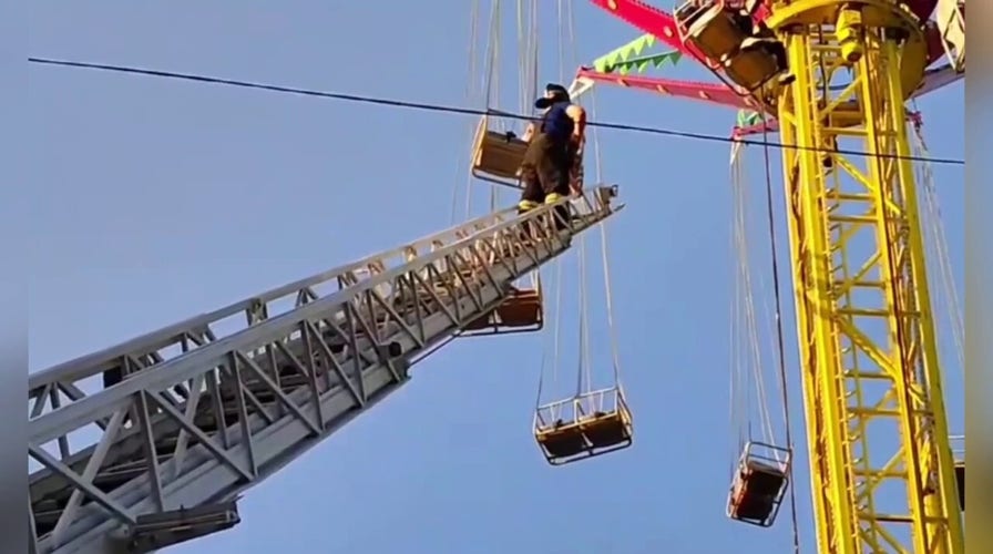 Emergency personnel rescue 13 people stranded on amusement park ride