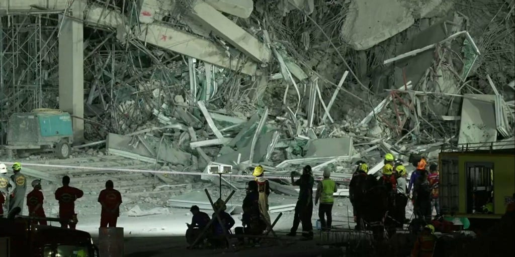 First responders clear leveled apartment building in Thailand after powerful earthquake