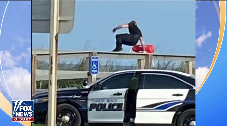 Florida police officer jumps out of squad car to rescue swimmers