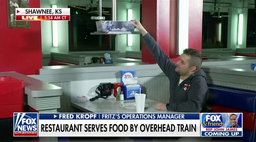 Kansas restaurant goes viral for serving food with overhead train system